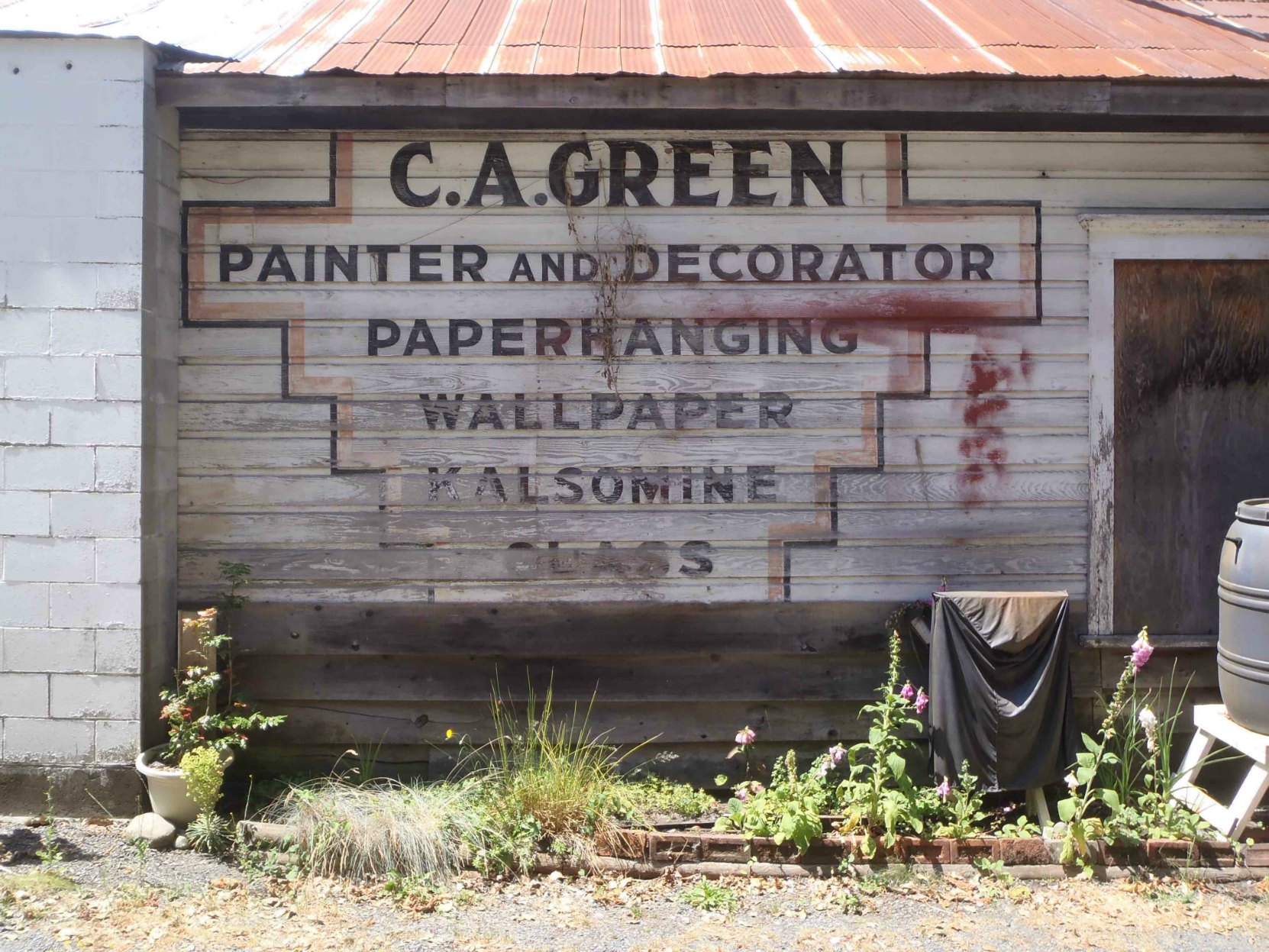 Claude Green business sign, circa 1940, is still visible on 161 Kenneth Street in downtown Duncan