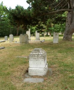 The Alexander Edmund Batson Davie (1846-1889) grave, Ross Bay Cemetery. The grave has been damaged over the years. A feature, possibly a cross, which once stood on top of the base has since disappeared.