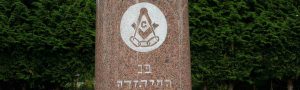 web header image showing the Masonic square & Compasses on Lewis Lewis' grave