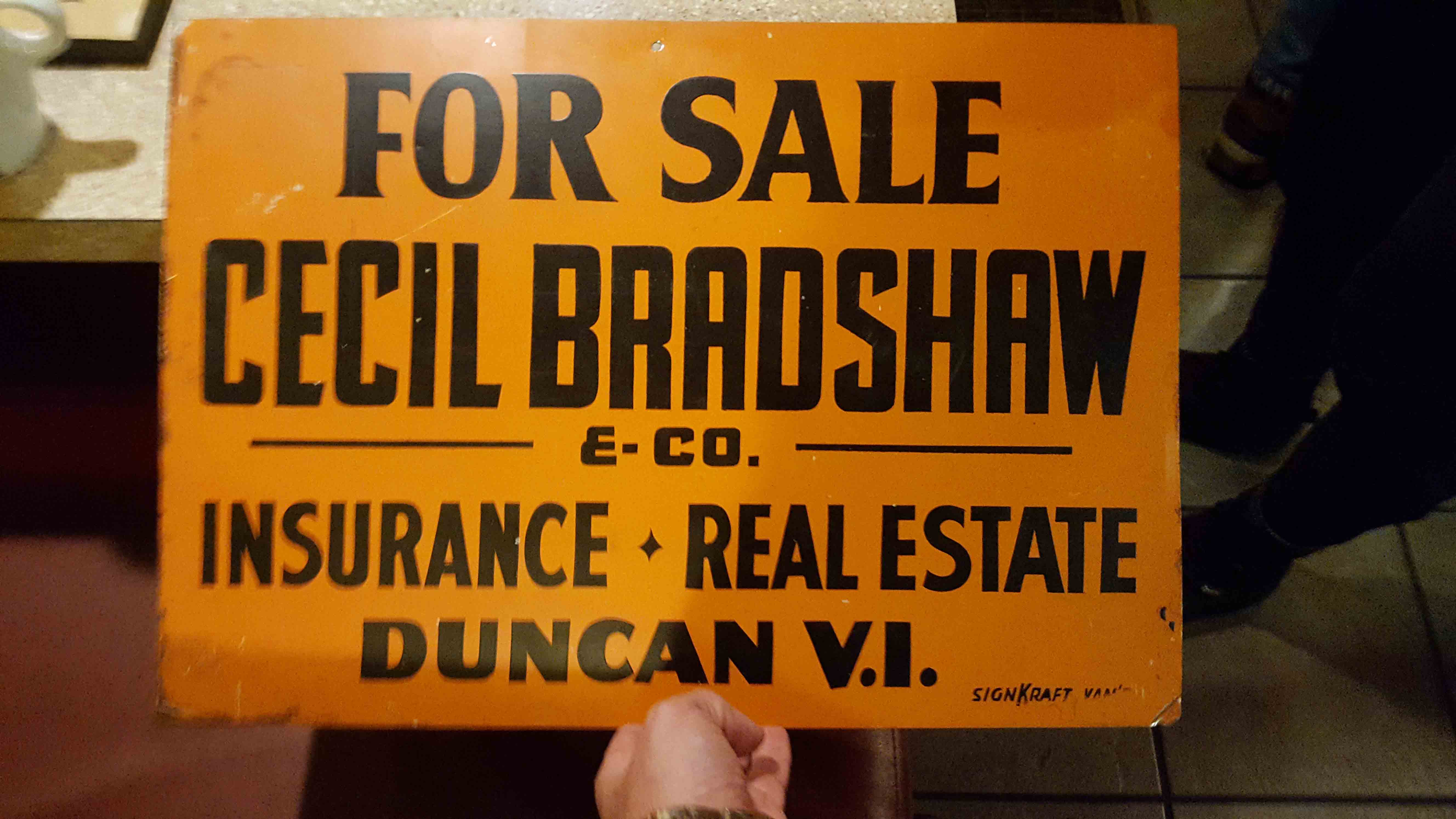 Sign for Cecil Bradshaw & Co. Insurance and Real Estate, circa 1930's. The sign is part of a private collection. Used with permission.