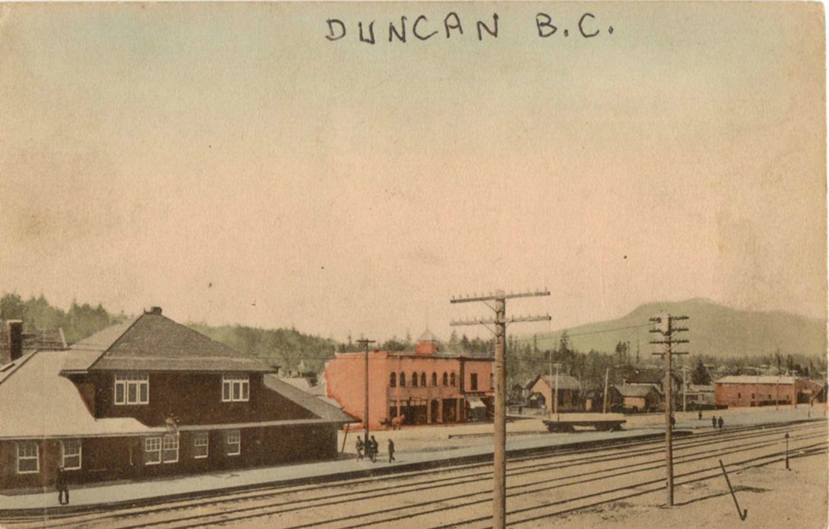 The E&N Railway Station (left) and the Duncan Masonic Temple (center) circa 1913-1914