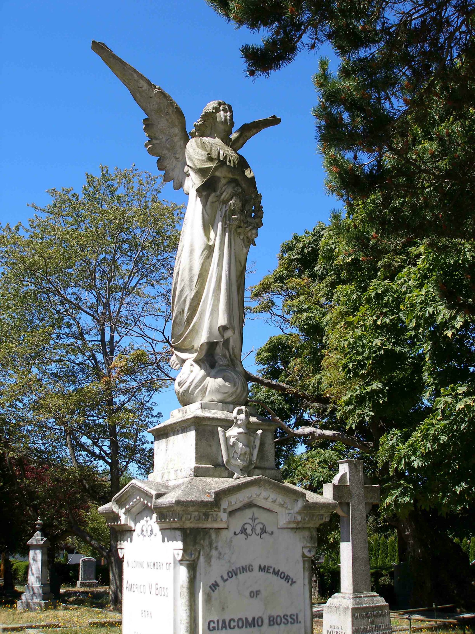 The angel figure on the Giacomo Bossi grave, Ross Bay Cemetery, Victoria, B.C. The "Bossi Angel" is one of the most photographed grave markers in Ross Bay Cemetery. (photo by Temple Lodge No. 33 Historian)