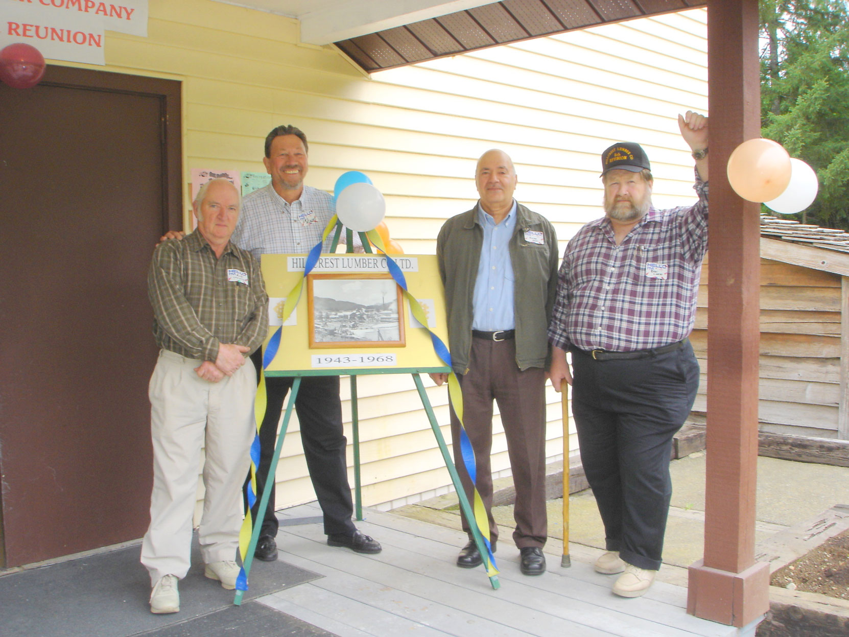 Bob Crawford (left), Cecil Ashley and others at the Hillcrest Lumber Co. Employees Reunion in 2006. (photo courtesy of Cecil Ashley)