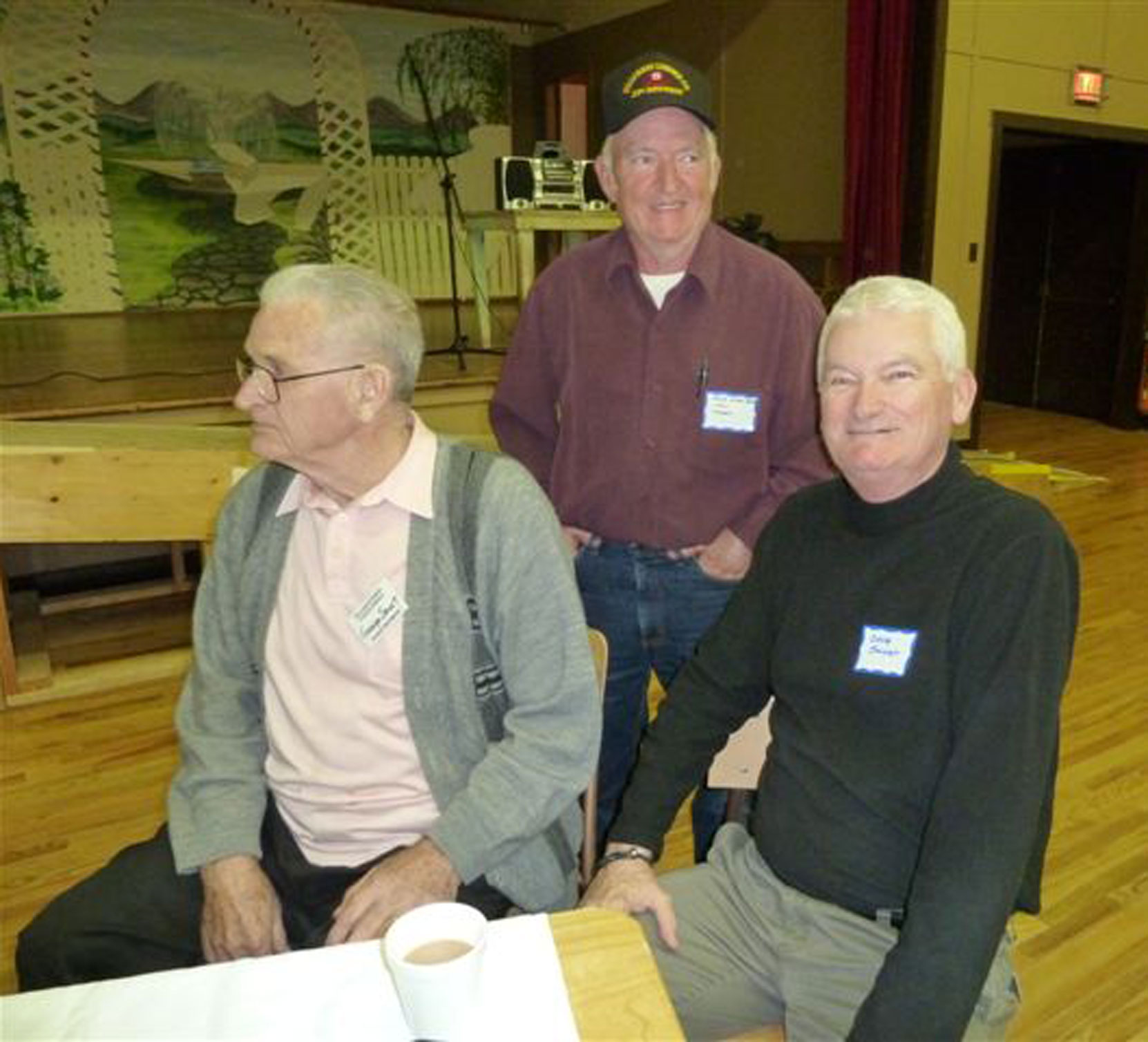 Bob Crawford (standing) at Hillcrest Lumber Company Employees Reunion, 2009. SEated left is George Smart, Woods manager for Hillcrest Lumber Company and Bob's boss when Bob was at Hillcrest. Seated right is George Smart's son Doug Smart. (photo: Cecil Ashley)