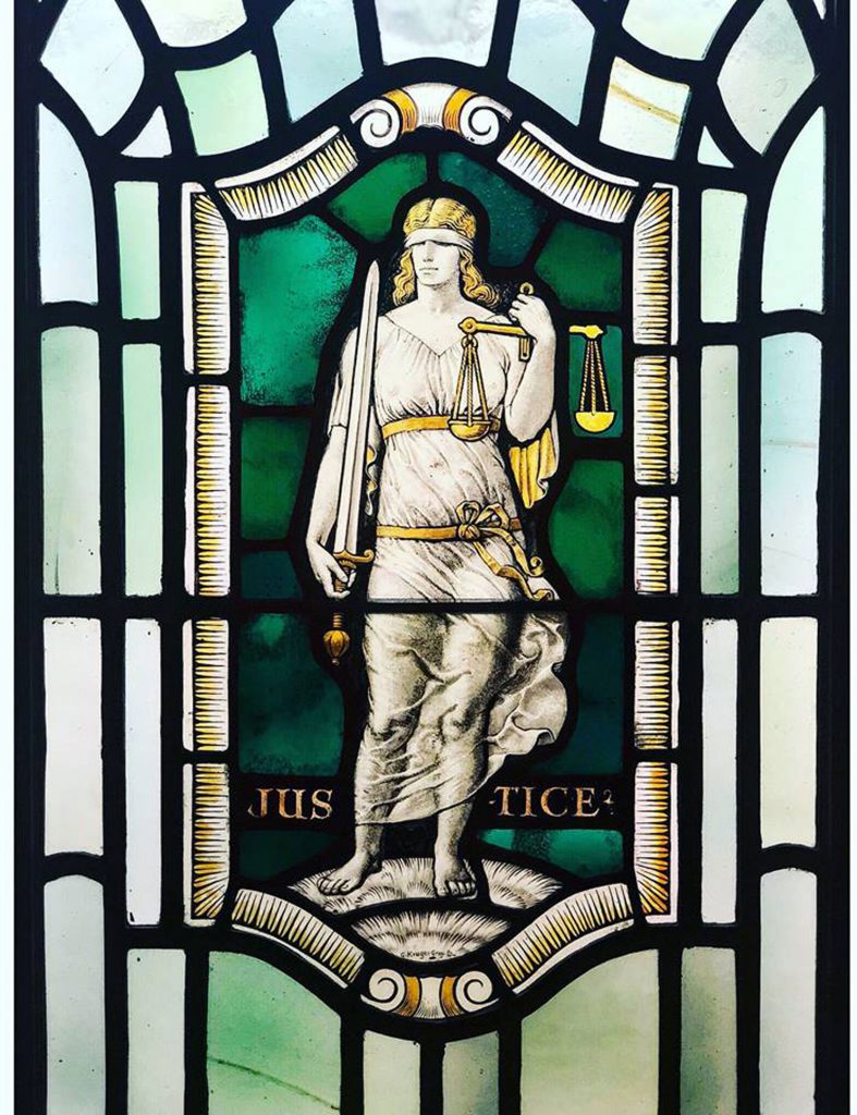 Stained glass in Freemasons Hall, London depicting Justice, one of the Four Cardinal Virtues: Prudence. Temperance. Fortitude and Justice (photo courtesy of United Grand Lodge of England)