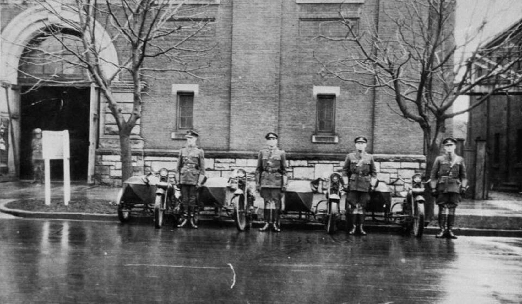 William Percy Aylward (left) with other members of the B.C. Provincial Police motorcycle squad in front of former drill Hall on Menzies Street in Victoria, circa 1926 (photo courtesy of Rick Aylward, used with permission)