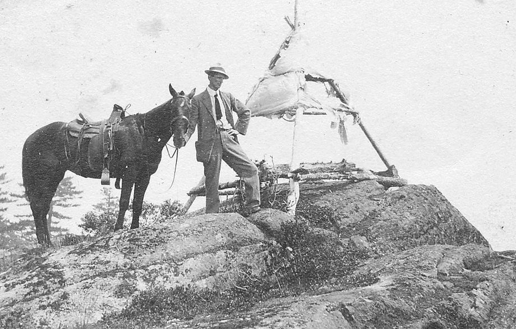 Ormond Towers Smythe on Mt. Prevost, circa 1920. The tent is for the surveyors' pin that is still on the west hump of Mt. Prevost. (photo courtesy of Larry Kier - private collection)